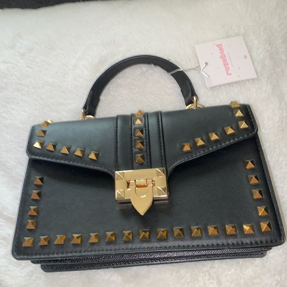 Black purse with gold spikes